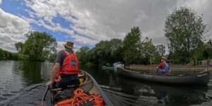 People in canoes on a river